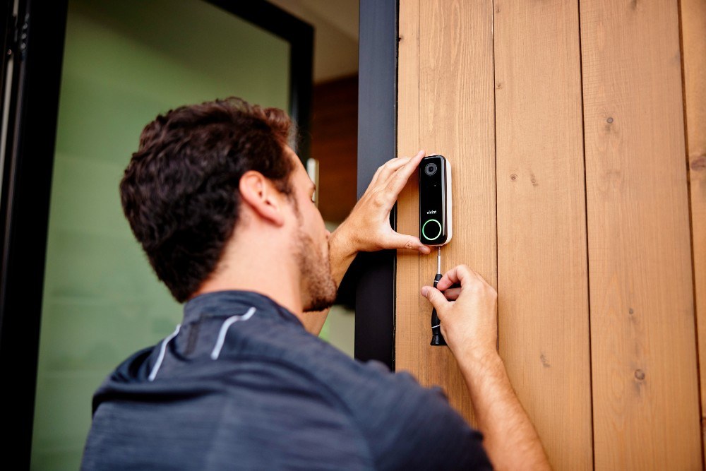 DecatHome smart home security device mounted near a front door in a rental or home entryway