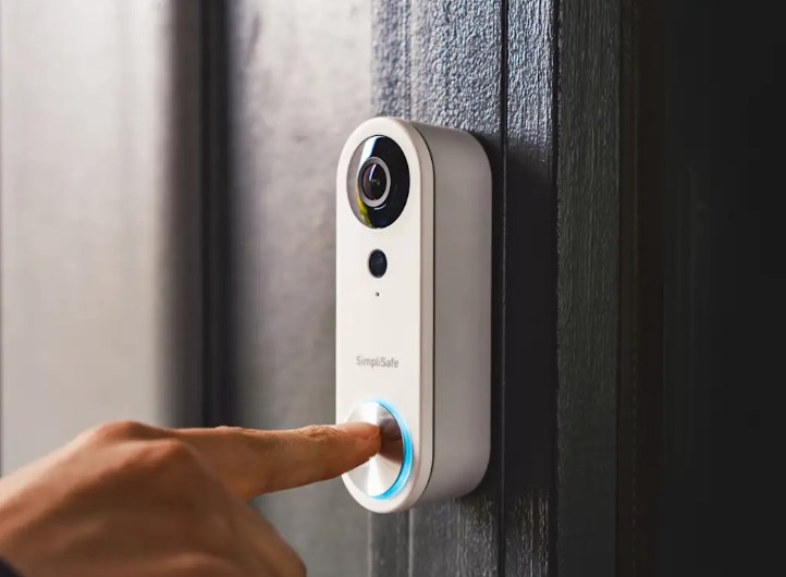 Homeowner checking doorbell compatibility, tools, and Wi-Fi setup before installing a video doorbell